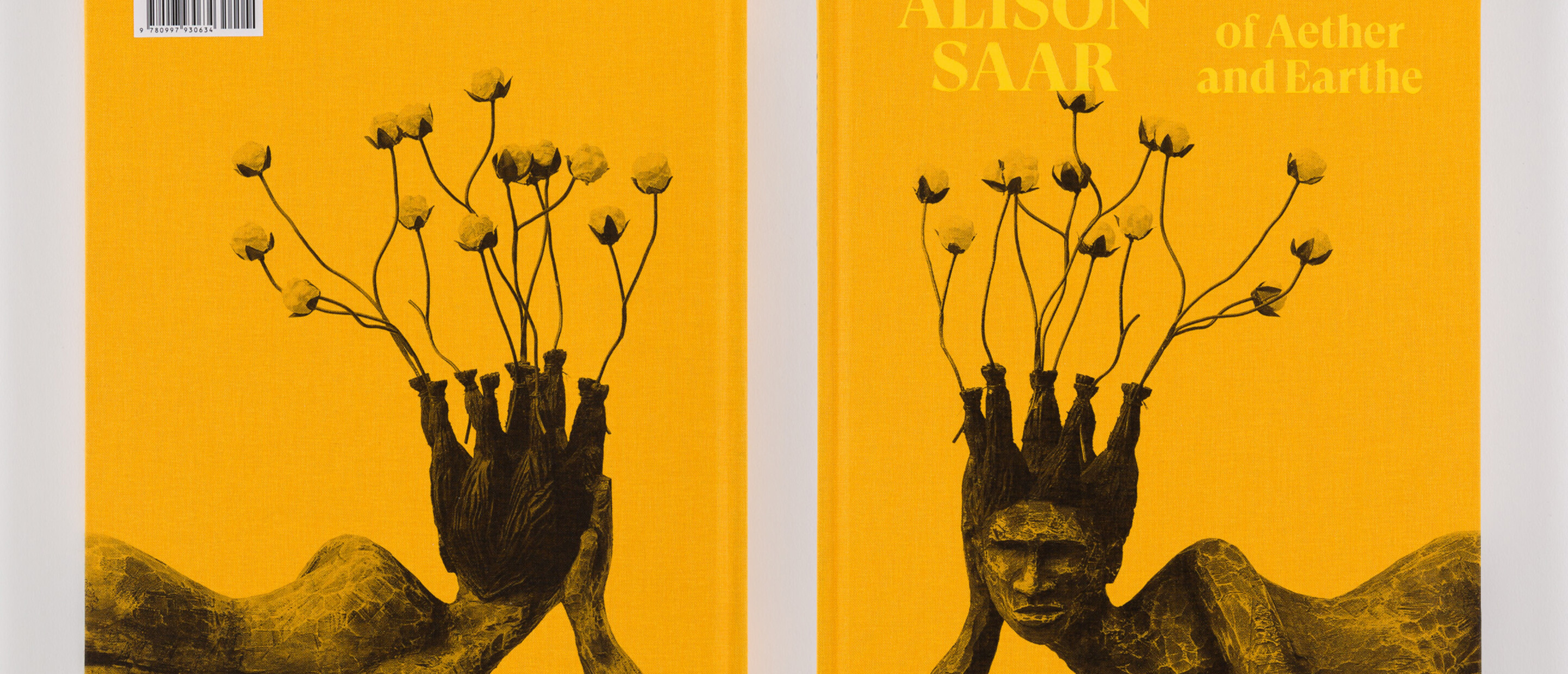 Photograph of both sides of a book titled Alison Saar: Of Aether and Earthe with image of sculpture front and back