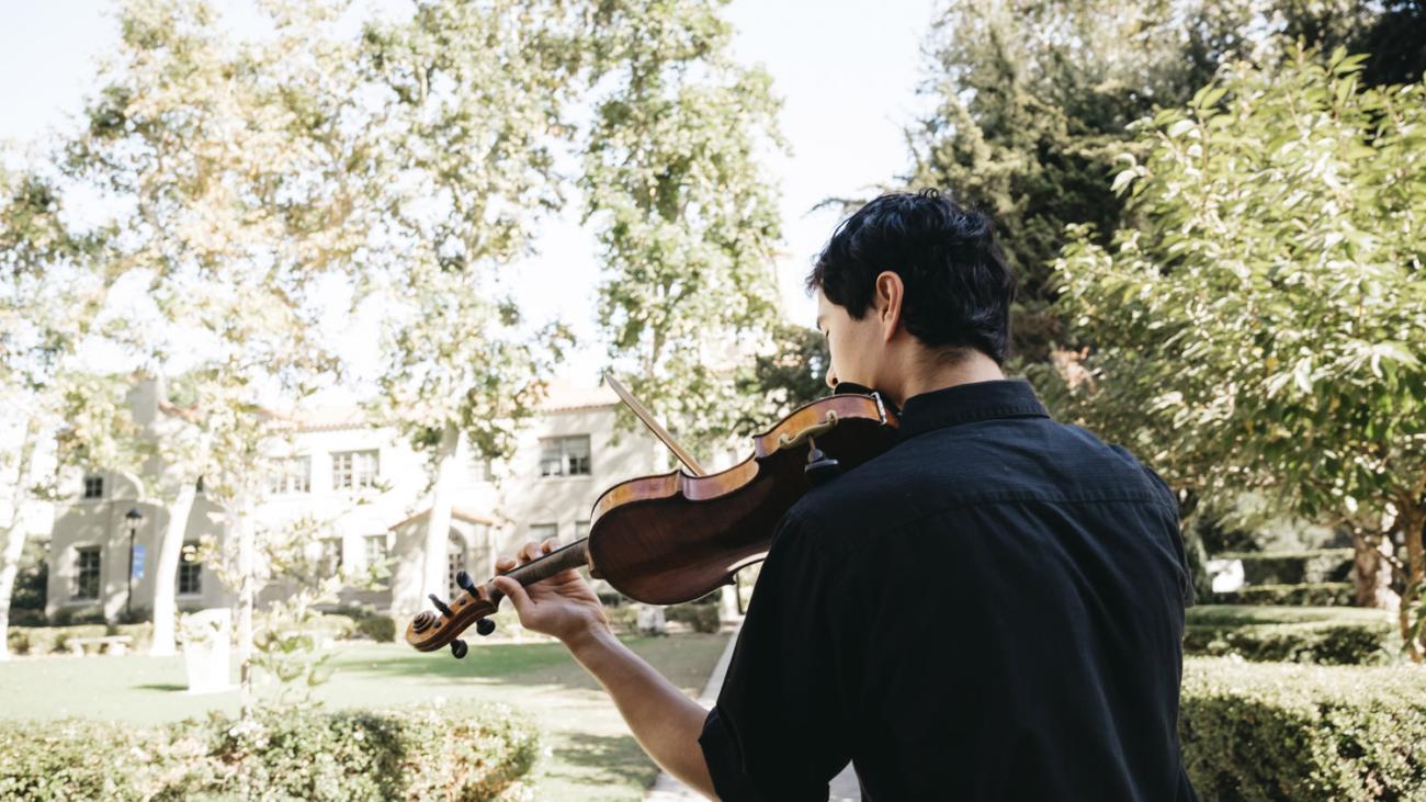 Pomona student playing instrument